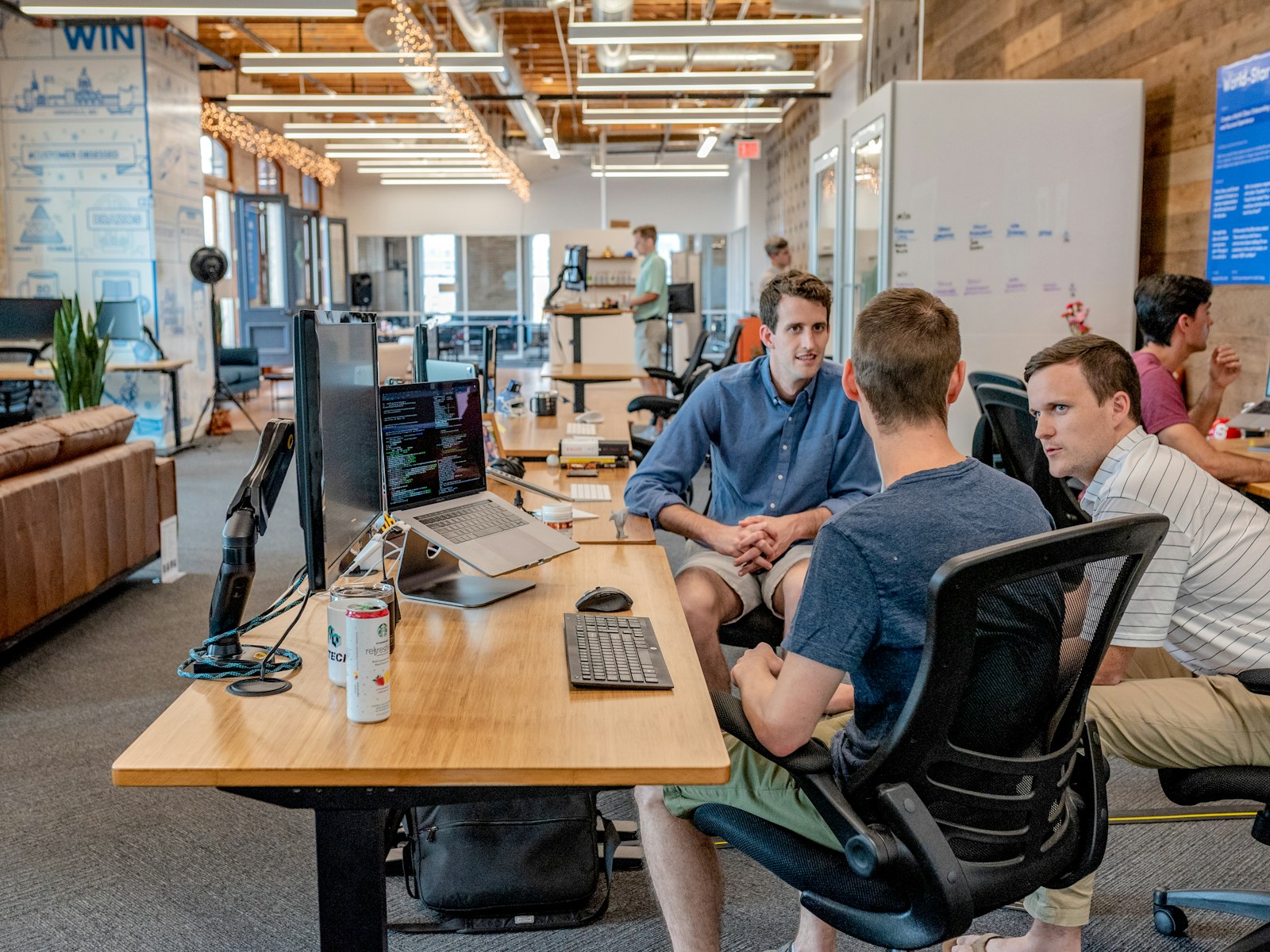 Consultants discussing work together in a modern office